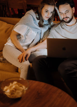 Family enjoying internet and TV entertainment